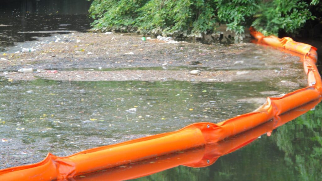 WavePlus Debris Boom deployed in a waterway to contain floating debris and maintain clean waterways.